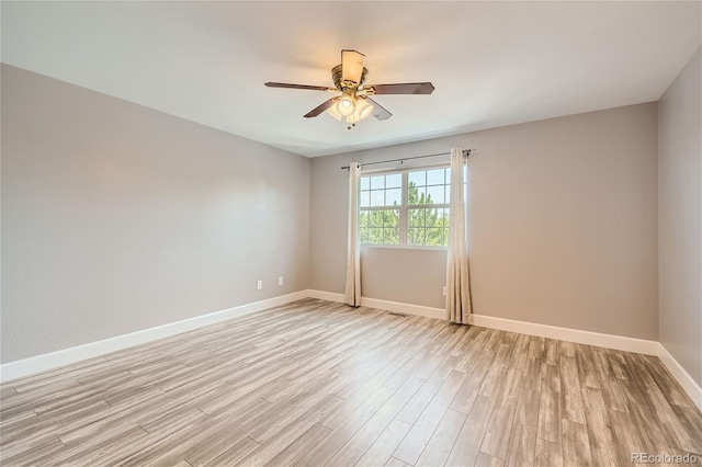 empty room with light hardwood / wood-style floors and ceiling fan