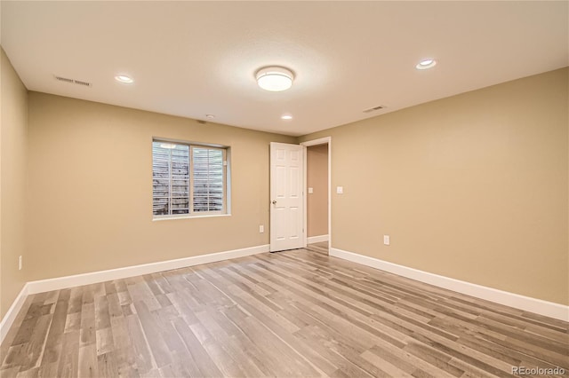 empty room featuring wood-type flooring