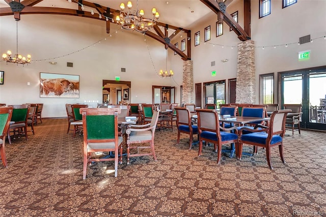 dining space featuring a high ceiling and a notable chandelier