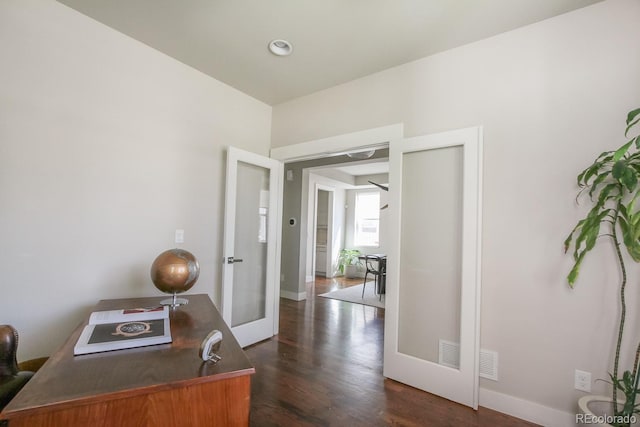 home office featuring french doors, baseboards, dark wood-style floors, and visible vents