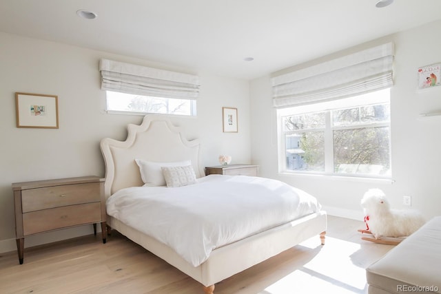 bedroom with light wood-style floors, recessed lighting, and baseboards