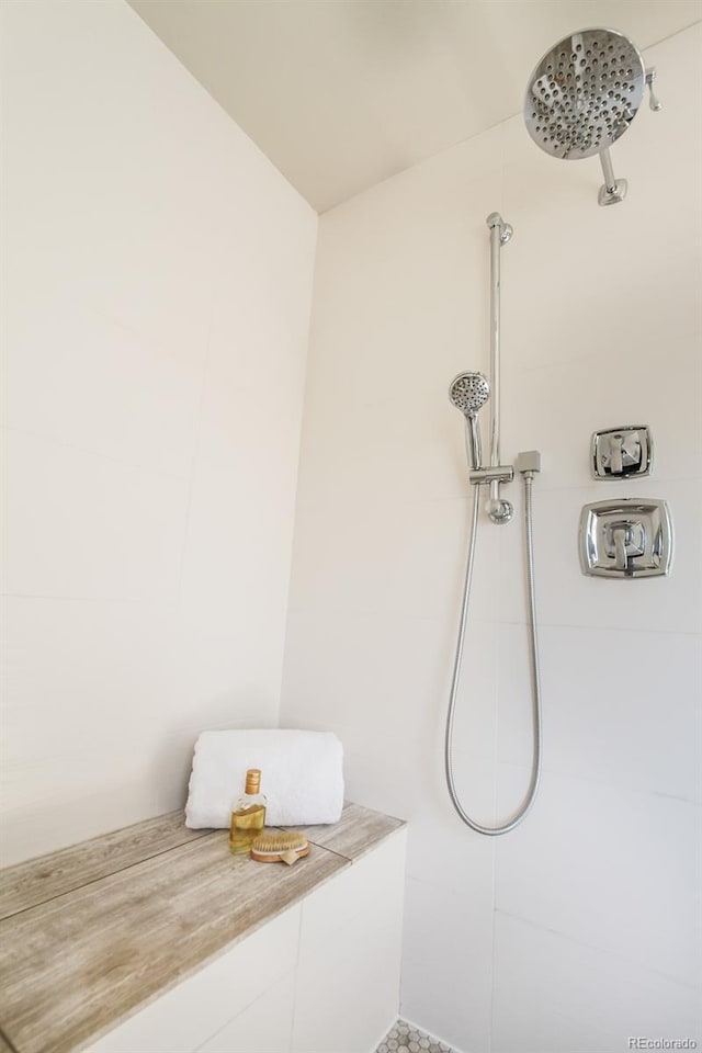 bathroom with a tile shower