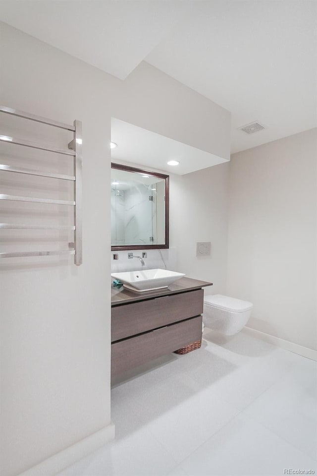 full bathroom with visible vents, vanity, toilet, baseboards, and an enclosed shower