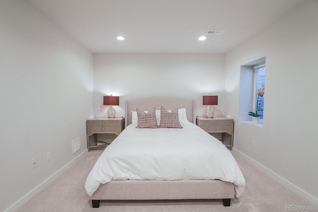 bedroom with visible vents, carpet, and baseboards