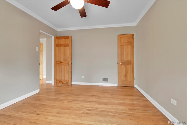 unfurnished room with crown molding, a ceiling fan, light wood finished floors, and baseboards