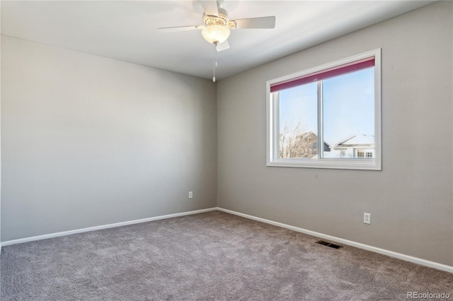 empty room with carpet and ceiling fan