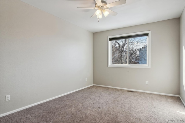 carpeted empty room with ceiling fan