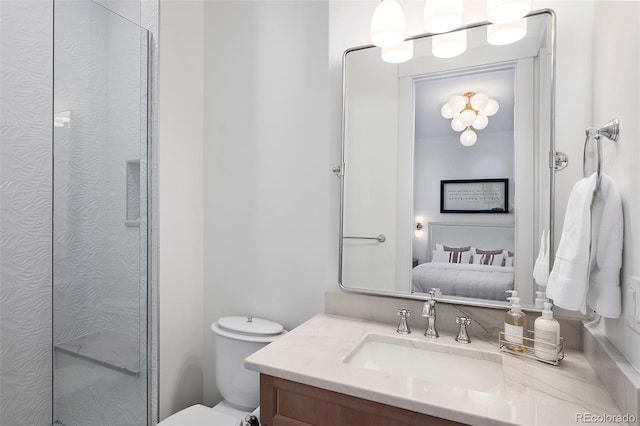 bathroom with walk in shower, vanity, and toilet