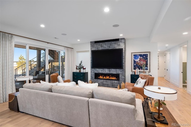 living room featuring a fireplace and light hardwood / wood-style floors