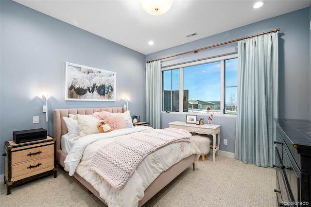 bedroom featuring light carpet