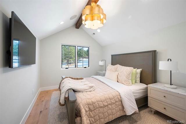 bedroom featuring vaulted ceiling with beams and light wood-type flooring