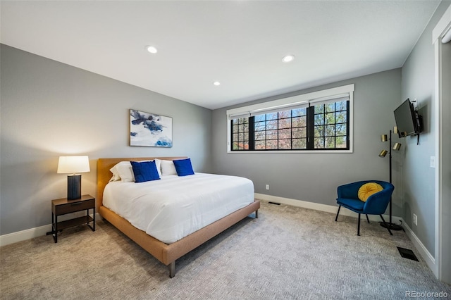 bedroom with carpet floors, recessed lighting, baseboards, and visible vents