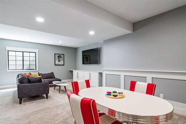 dining area with recessed lighting, baseboards, and light colored carpet