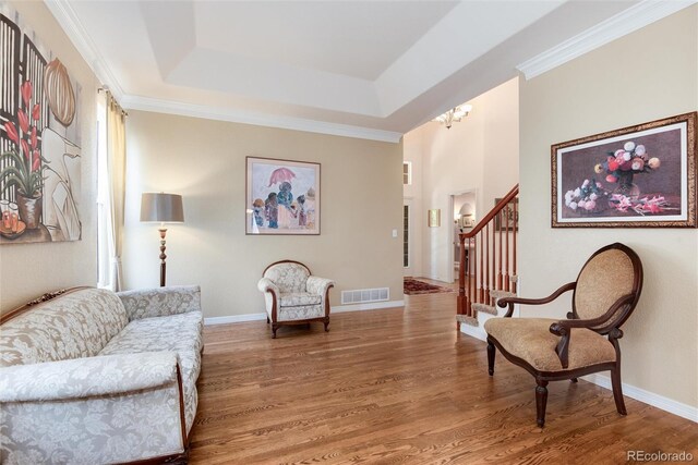 2959 W 110th Pl, Westminster, CO 80234 - living area featuring wood finished floors, stairs, baseboards, and a chandelier
