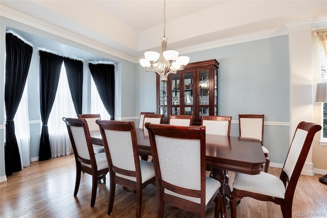 2959 W 110th Pl, Westminster, CO 80234 - dining room featuring a chandelier, light wood finished floors, baseboards, and ornamental molding