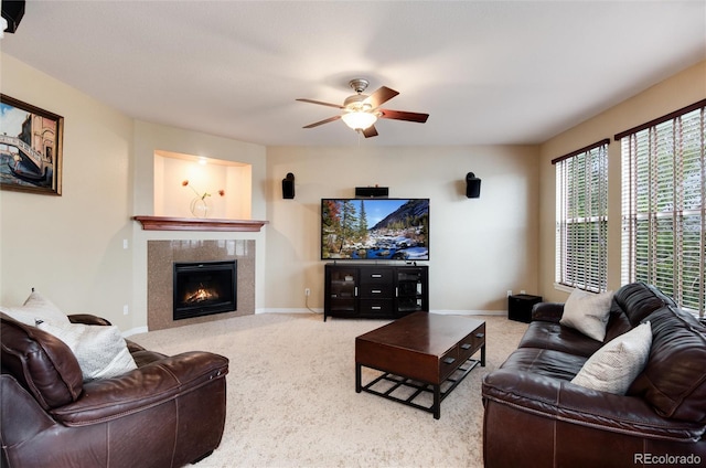 2959 W 110th Pl, Westminster, CO 80234 - carpeted living room with ceiling fan, a tiled fireplace, and baseboards