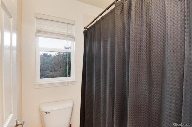 2959 W 110th Pl, Westminster, CO 80234 - full bathroom featuring toilet and a shower with curtain