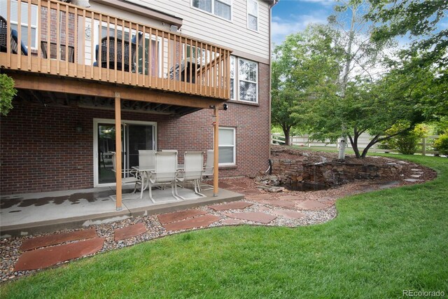 2959 W 110th Pl, Westminster, CO 80234 - rear view of property featuring a yard, a patio area, and brick siding