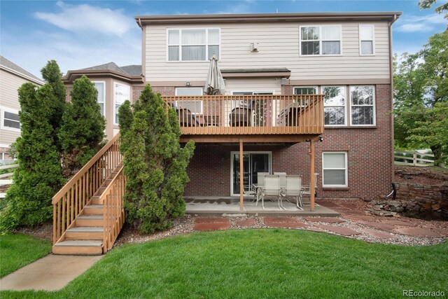 2959 W 110th Pl, Westminster, CO 80234 - back of property featuring brick siding, a yard, a patio, and a deck