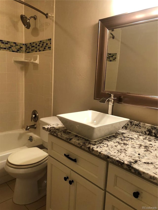 bathroom with toilet, tile patterned floors, bathtub / shower combination, and vanity