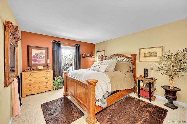 bedroom featuring baseboards