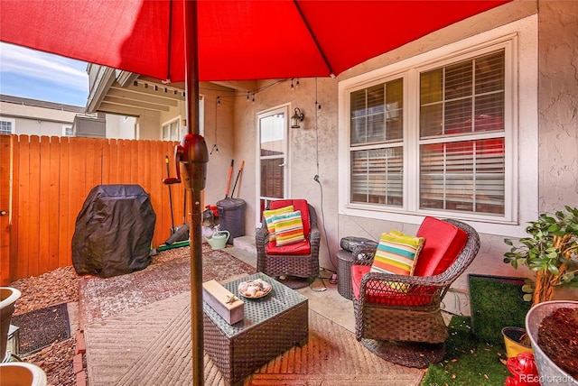 view of patio / terrace featuring fence and an outdoor hangout area