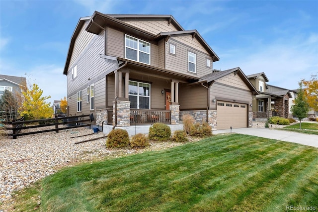 craftsman house with a porch, a garage, and a front lawn