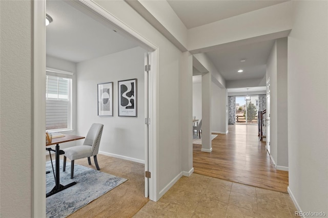 hallway with light tile patterned floors