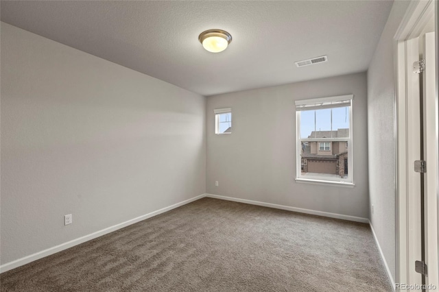 spare room featuring carpet flooring