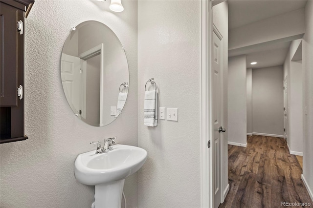 bathroom featuring hardwood / wood-style floors and sink