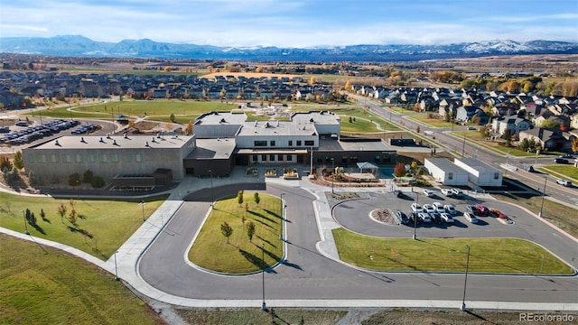 birds eye view of property featuring a mountain view