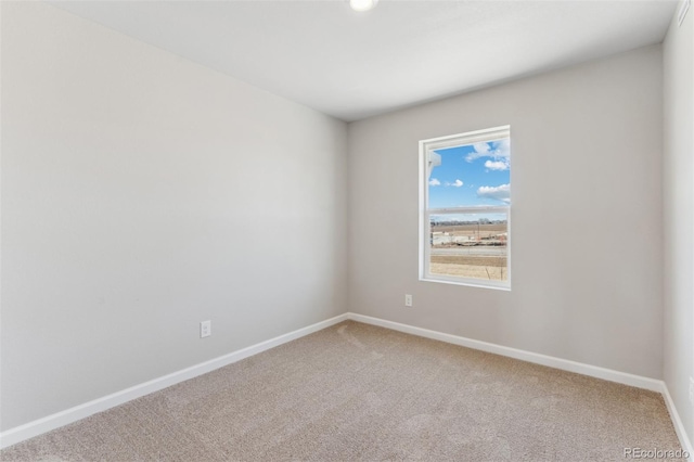 unfurnished room with carpet flooring