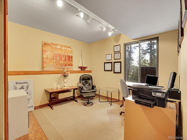 office featuring track lighting and light parquet floors