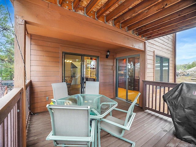 wooden terrace featuring grilling area