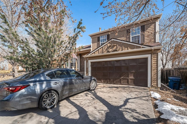 view of front of house featuring a garage, concrete driveway, and board and batten siding