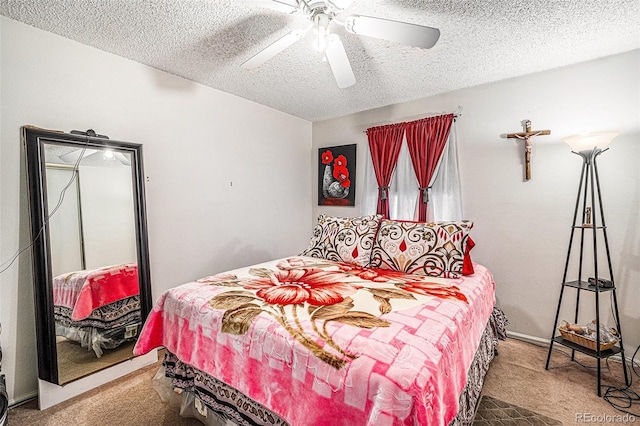 carpeted bedroom with a ceiling fan and a textured ceiling