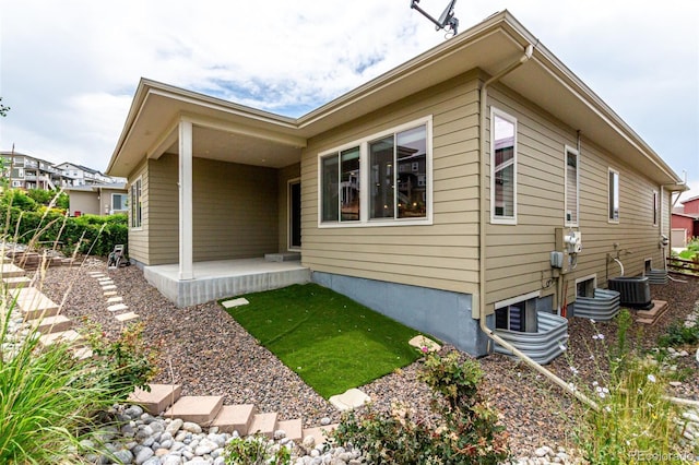 17490 W 94th Dr, Arvada, CO 80007 - view of side of home with a cooling unit