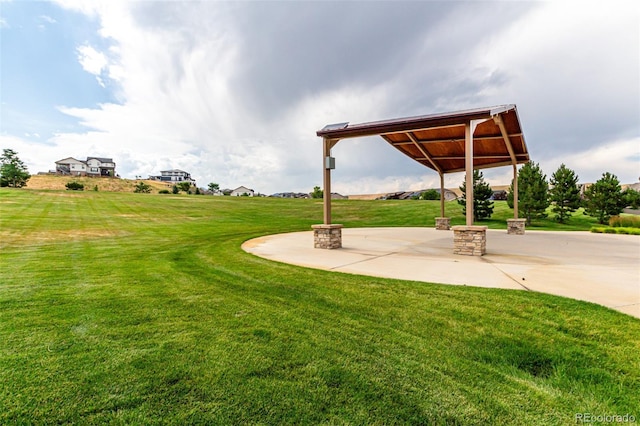 17490 W 94th Dr, Arvada, CO 80007 - view of green lawn with a patio