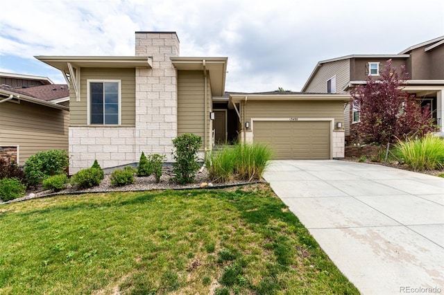 17490 W 94th Dr, Arvada, CO 80007 - view of front of home featuring driveway, a front yard, a garage, a chimney, and stone siding