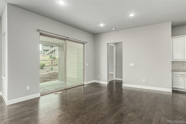 17490 W 94th Dr, Arvada, CO 80007 - unfurnished living room featuring dark wood-type flooring and recessed lighting