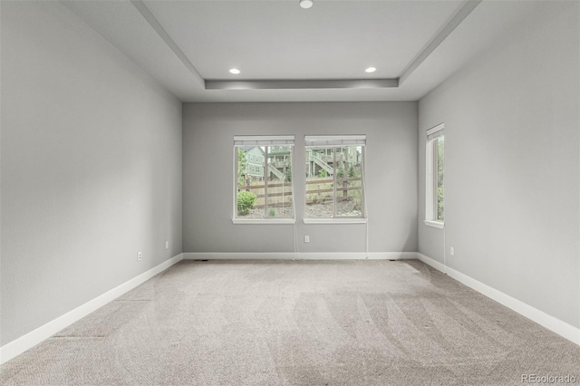17490 W 94th Dr, Arvada, CO 80007 - carpeted empty room with healthy amount of natural light, a raised ceiling, and recessed lighting