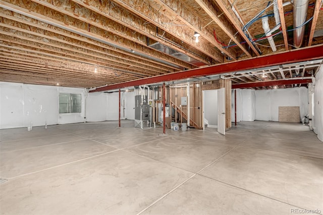 17490 W 94th Dr, Arvada, CO 80007 - unfinished basement featuring heating unit and electric water heater