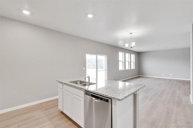 kitchen with stainless steel dishwasher, white cabinets, sink, and light hardwood / wood-style flooring