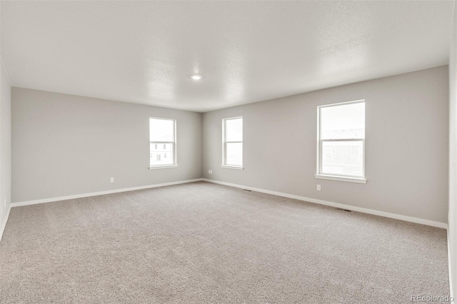 empty room featuring carpet flooring