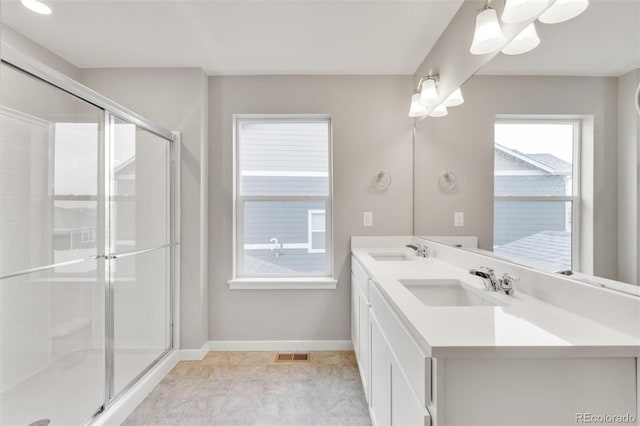 bathroom with vanity and walk in shower