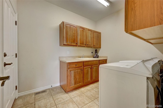 4864 Harness Ct, Parker, CO 80134 - washroom with washer / dryer, cabinet space, light tile patterned floors, and baseboards