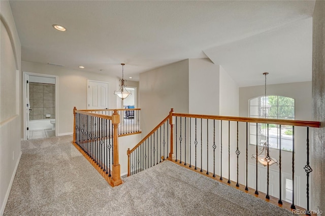 4864 Harness Ct, Parker, CO 80134 - hallway with an upstairs landing, recessed lighting, carpet floors, and baseboards