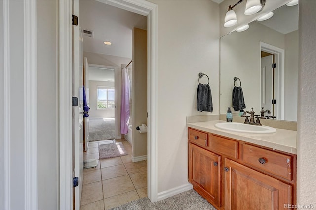 4864 Harness Ct, Parker, CO 80134 - bathroom with vanity, tile patterned flooring, a shower with shower curtain, and baseboards