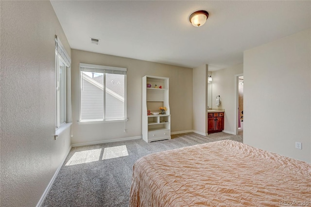 4864 Harness Ct, Parker, CO 80134 - bedroom featuring light carpet, baseboards, and connected bathroom