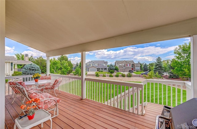4864 Harness Ct, Parker, CO 80134 - wooden deck featuring outdoor dining space, a residential view, and a lawn
